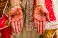 Indian bride with henna painted on arm and hands Royalty Free Stock Photo