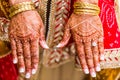 Indian bride with henna painted on arm and hands Royalty Free Stock Photo