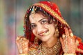 Indian bride in her wedding dress showing Royalty Free Stock Photo