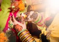 Indian bride holding candle in her hand. Focus on hand Royalty Free Stock Photo