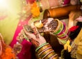 Indian bride holding candle in her hand. Focus on hand Royalty Free Stock Photo