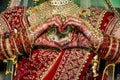 Indian bride making heart shape by her hands Royalty Free Stock Photo