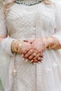 Indian bride's hands are decorated with Indian style henna bracelets and patterns