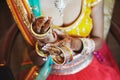 Indian bride wear saree putting the bracelets bangle on hand with mehndi, close-up Royalty Free Stock Photo