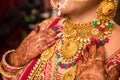 Indian bride wearing heavy jewellery gold necklace, Royalty Free Stock Photo