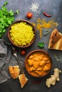 Indian and British dish spicy chicken tikka masala with rice and naan. Top view, flat lay Royalty Free Stock Photo