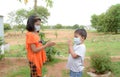 Indian brother and sister with wearing mask