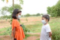 Indian brother and sister with wearing mask