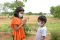 Indian brother and sister with wearing mask