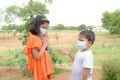 Indian brother and sister with wearing mask