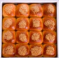 Tray of sesame coated buns Royalty Free Stock Photo