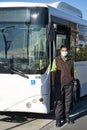 Indian bus driver wearing face mask and gloves against Covid-19 pandemic virus