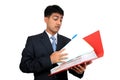 Indian business man looking at a file. Royalty Free Stock Photo