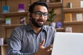 Indian business man speaking having virtual meeting on laptop.