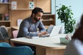 Indian business man student working or studying on laptop computer. Royalty Free Stock Photo