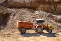 Indian business. Tractor in a gravel pit