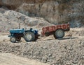 Indian business. Tractor in a gravel pit