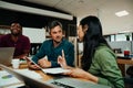 Indian business woman discussing work with colleague brainstorming ideas to present before meeting Royalty Free Stock Photo