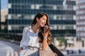 Indian business woman sending voice message with her phone Royalty Free Stock Photo