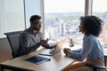 Indian latin hr manager on interview with African American applicant in office. Royalty Free Stock Photo