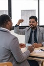 Indian businessman is having a discussion with an African American real estate agent Royalty Free Stock Photo