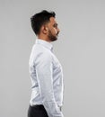 Indian businessman side view over grey background