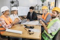 Indian businessman signs contract and documents of senior woman boss of a construction company. Royalty Free Stock Photo