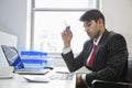 An Indian businessman working at office desk Royalty Free Stock Photo