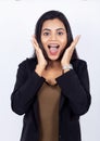 Indian businesswoman with hands on face acting surprised