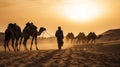 indian (camel driver) bedouin with camel silhouettes in sand dunes of Thar desert on sunset Royalty Free Stock Photo