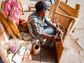 an indian carpenter making bedroom furniture at outside of the workshop in india January 2020