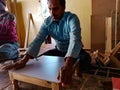 an indian carpenter making plywood item at workshop in india January 2020