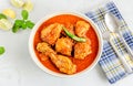 Indian Chicken Curry in a Bowl with Fork and Spoon on White Background Royalty Free Stock Photo