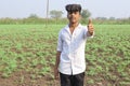 Indian child showing thumbs up agriculture field Royalty Free Stock Photo