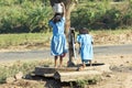 Indian children at the water pump