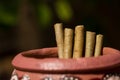 Indian cigarettes in a clay pitcher