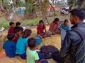 indian city boy giving laptop training to the poor childrens at open environment in India January 2020 Royalty Free Stock Photo