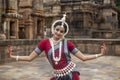 Indian classical odissi dancer wears traditional costume posing Mudra or Hand Gestures.