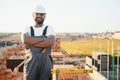 Indian Construction worker man in work clothes and a construction helmet. Portrait of positive male builder in hardhat Royalty Free Stock Photo