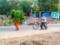 Couple farmer went his house from farm