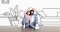 Indian Couple Making Roof Near Wall With Drawn Living Room Royalty Free Stock Photo