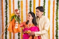 Indian Couple performing or celebrating Gudi Padwa Puja