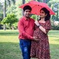 Indian couple posing for Maternity shoot pose for welcoming new born baby in Lodhi Road in Delhi India, Maternity photo shoot done