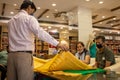 An Indian couple shopping for a saree, wearing a face mask in the Corona epidemic.