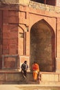 Indian couple sitting at Humayuns private library, Purana Qila,