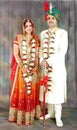 Indian couple in their wedding dress