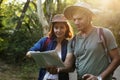 Indian Couple trekking together through forest Royalty Free Stock Photo