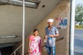 Indian couple at underground subway gate