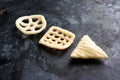 Indian crunchy fryums or papad snack in wheel, square and triangle shape