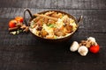 Indian cuisine-tasty fish pilaf or biriyani in cast iron pot,